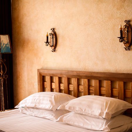 Caucasus Hotel Kasagh Exteriör bild A bed with two pillows