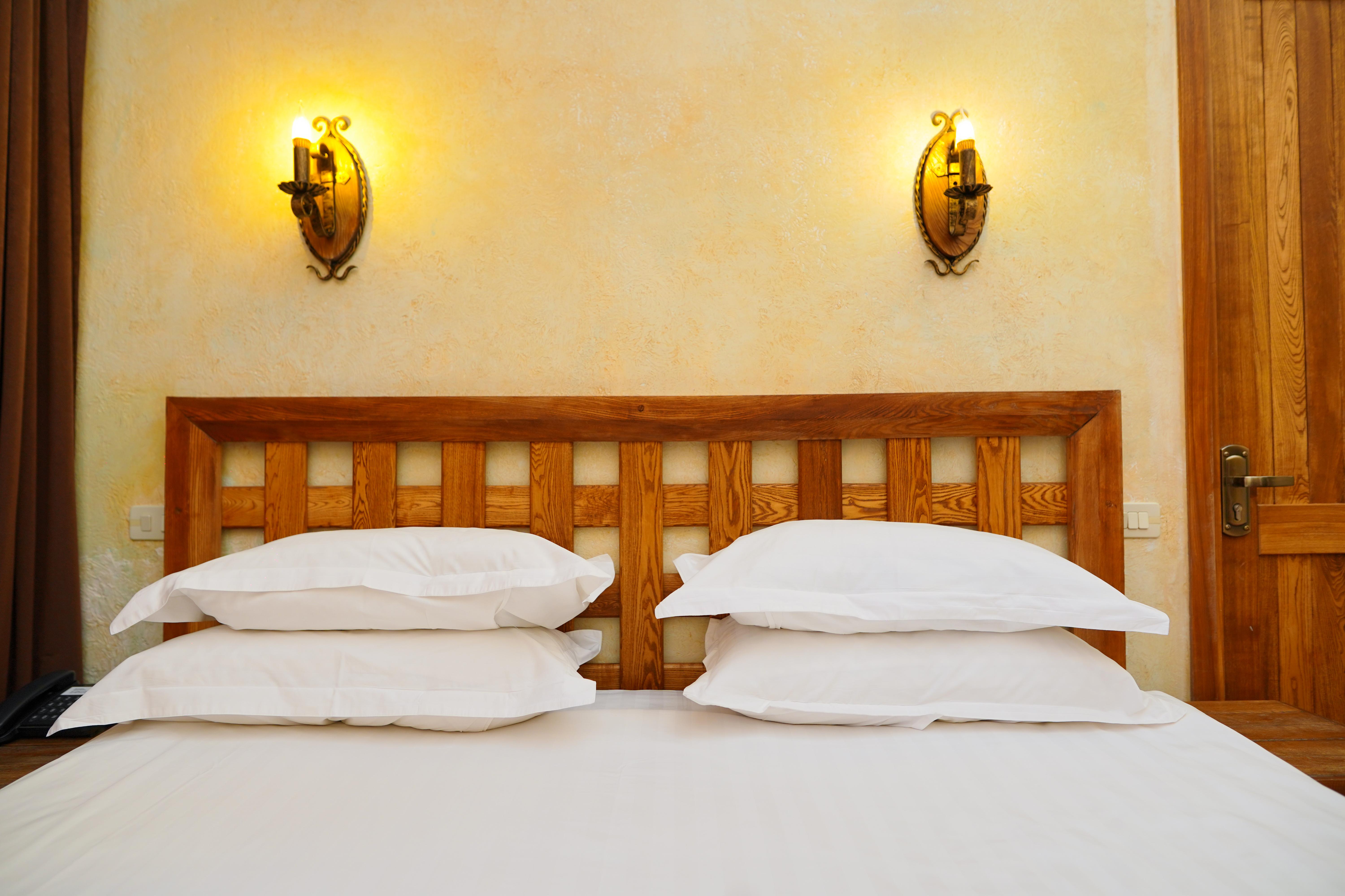Caucasus Hotel Kasagh Exteriör bild A bed with two pillows